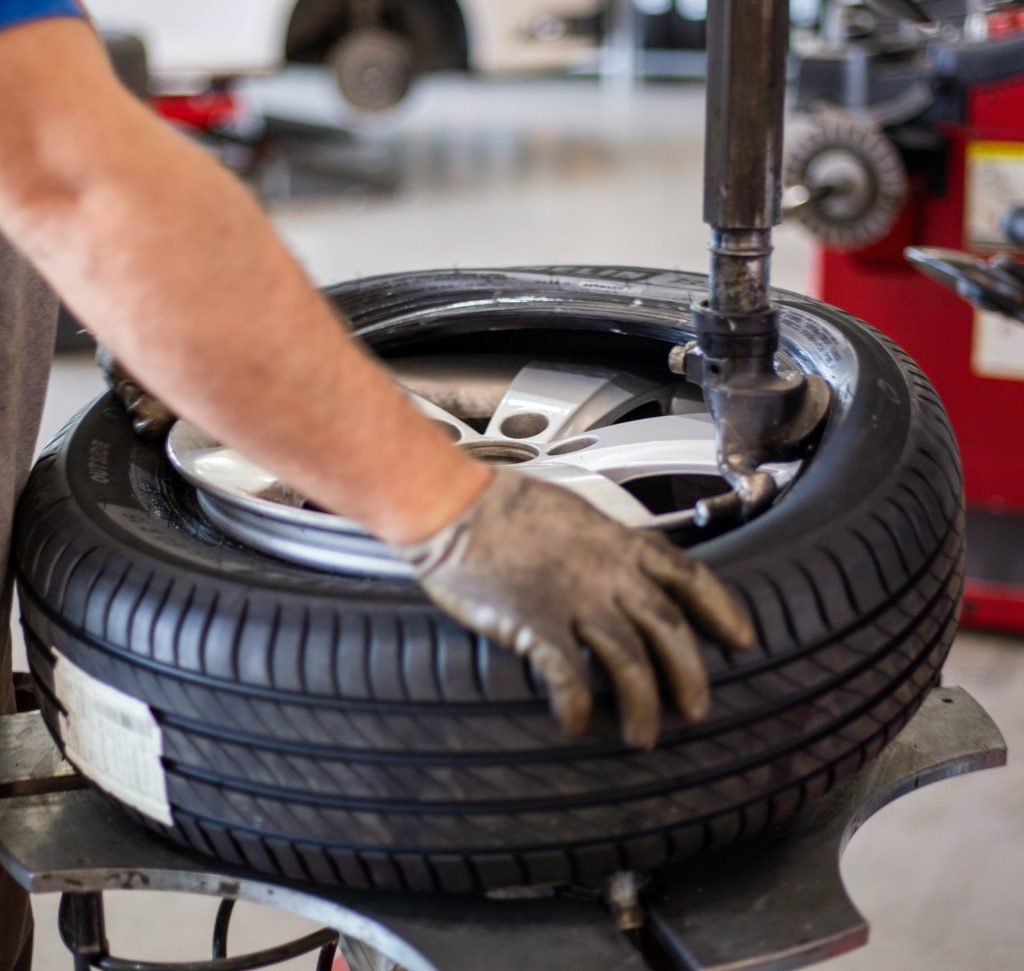 person holding black and gray metal tool